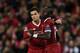 Liverpool's Senegalese midfielder Sadio Mane (R) celebrates scoring their sixth goal with Liverpool's Brazilian midfielder Philippe Coutinho (L) during the UEFA Champions League Group E football match between Liverpool and Spartak Moscow at Anfield in Liverpool, north-west England on December 6, 2017. / AFP PHOTO / Paul ELLIS (Photo credit should read PAUL ELLIS/AFP/Getty Images)