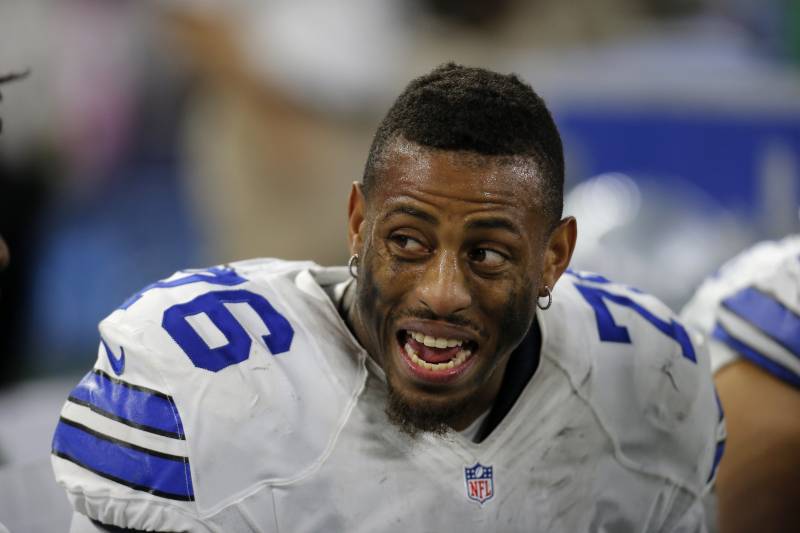 Dallas Cowboys' Greg Hardy (76) talks with teammates on the bench in the second half of an NFL football game against the Philadelphia Eagles on Sunday, Nov. 8, 2015, in Arlington, Texas. (AP Photo/Brandon Wade)