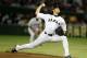 FILE - In this Nov. 19, 2015, file photo, Japan's starter Shohei Otani pitches against South Korea during the first inning of their semifinal game at the Premier12 world baseball tournament at Tokyo Dome in Tokyo. A person familiar with the decision says Major League Baseball owners on Friday, Dec. 1, 2017, have approved a new posting agreement with their Japanese counterparts in a move that allows bidding to start for coveted pitcher and outfielder Shohei Ohtani. The person spoke on condition of anonymity because no announcement had been made. (AP Photo/Toru Takahashi, File)