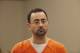 Dr. Larry Nassar, 54, appears in court for a plea hearing in Lansing, Mich., Wednesday, Nov. 22, 2017. Nasser, a sports doctor accused of molesting girls while working for USA Gymnastics and Michigan State University, pleaded guilty to multiple charges of sexual assault and will face at least 25 years in prison. (AP Photo/Paul Sancya)