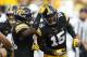 FILE - In this Sept. 16, 2017, file photo, Iowa's Josh Jackson (15) celebrates with teammate Miles Taylor, left, after intercepting a pass during the second half of an NCAA college football game against North Texas, in Iowa City, Iowa. Jackson was selected to the 2017 AP All-Conference Big Ten team announced Wednesday, Dec. 6, 2017. (AP Photo/Charlie Neibergall, File)