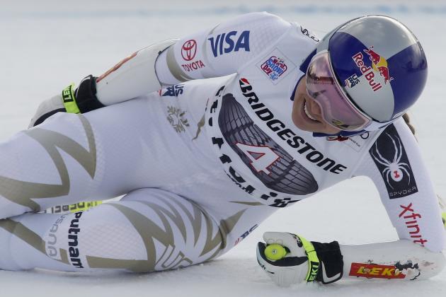 United States' Lindsey Vonn grimaces in pain after getting to the finish area of an alpine ski, women's World Cup super-G, in St. Moritz, Switzerland, Saturday, Dec. 9, 2017. (AP Photo/Giovanni Auletta)