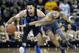 Duke's Gary Trent Jr (2) keeps the ball away form Boston College's Ky Bowman (0) during the first half of an NCAA college basketball game in Boston, Saturday, Dec. 9, 2017. (AP Photo/Michael Dwyer)