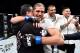 FRESNO, CA - DECEMBER 09: Brian Ortega hugs his dad after his submission victory over Cub Swanson in their featherweight bout during the UFC Fight Night event inside Save Mart Center on December 9, 2017 in Fresno, California. (Photo by Jeff Bottari/Zuffa LLC/Zuffa LLC via Getty Images)