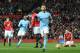 Manchester City's Argentinian defender Nicolas Otamendi (C) celebrates scoring their second goal during the English Premier League football match between Manchester United and Manchester City at Old Trafford in Manchester, north west England, on December 10, 2017. / AFP PHOTO / Oli SCARFF / RESTRICTED TO EDITORIAL USE. No use with unauthorized audio, video, data, fixture lists, club/league logos or 'live' services. Online in-match use limited to 75 images, no video emulation. No use in betting, games or single club/league/player publications. / (Photo credit should read OLI SCARFF/AFP/Getty Images)