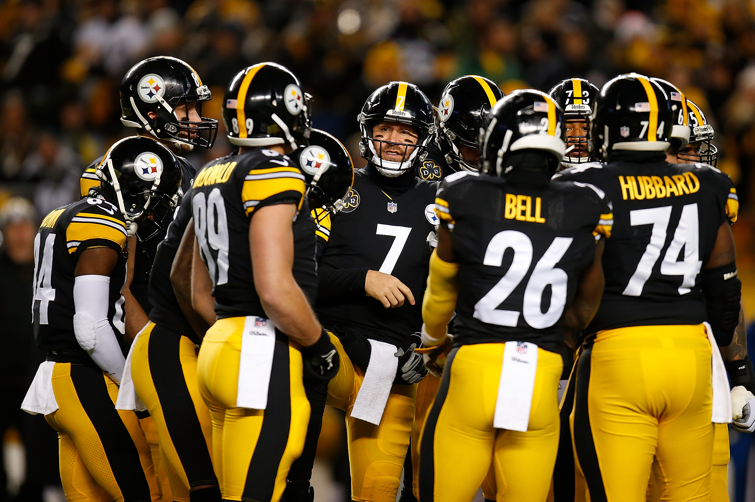 Pittsburgh Steelers quarterback Ben Roethlisberger (7) walks off the field  holding the jersey of linebacker Ryan Shazier after beating the Baltimore  Ravens 39-38 to clinch the AFC North Championship in an NFL