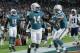 Miami Dolphins wide receiver Kenny Stills (10) congratulates wide receiver Jarvis Landry (14) after Landry scored a touchdown, during the first half of an NFL football game against the New England Patriots, Monday, Dec. 11, 2017, in Miami Gardens, Fla. (AP Photo/Lynne Sladky)