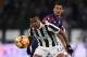 Juventus' defender Alex Sandro from Brazil eyes the ball during the Italian Serie A football match Juventus Vs Crotone on November 26, 2017 at the 'Allianz Stadium' in Turin. / AFP PHOTO / MARCO BERTORELLO (Photo credit should read MARCO BERTORELLO/AFP/Getty Images)