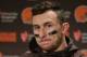 FILE - In this Dec. 20, 2015, file photo, Cleveland Browns quarterback Johnny Manziel speaks with media members following the team's 30-13 loss to the Seattle Seahawks in an NFL football game, in Seattle. Manziel has been suspended for the first four games of next season for violating the NFL's substance-abuse policy.The suspension announced Thursday, June 30, 2016, is not related to the NFL's domestic violence policy, but the free agent quarterback would be subject to it if he signs with another team. (AP Photo/Scott Eklund, File)