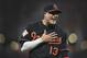 Baltimore Orioles' Manny Machado reacts to something from the bench of the Tampa Bay Rays before a baseball game, Friday, Sept. 22, 2017, in Baltimore. (AP Photo/Gail Burton)