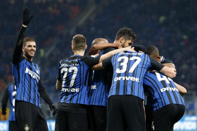 Inter Milan's Ivan Perisic, covered by his teammates, celebrates after scoring during the Serie A soccer match between Inter Milan and Chievo Verona at the San Siro stadium in Milan, Italy, Sunday, Dec. 3, 2017. (AP Photo/Antonio Calanni)