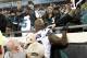 Seattle Seahawks defensive tackle Quinton Jefferson, center, tries to climb up in the stands after Jacksonville Jaguars fans threw objects at him in the closing moments of an NFL football game, Sunday, Dec. 10, 2017, in Jacksonville, Fla. Jacksonville won 30-24. (AP Photo/Stephen B. Morton)