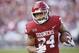 Oklahoma running back Rodney Anderson (24) carries in the second quarter of an NCAA college football game against West Virginia in Norman, Okla., Saturday, Nov. 25, 2017. (AP Photo/Sue Ogrocki)