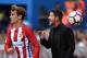 Atletico Madrid's French forward Antoine Griezmann (L) throws the ball beside Atletico Madrid's Argentinian coach Diego Simeone during the Spanish league football match Club Atletico de Madrid vs RC Deportivo de la Coruna at the Vicente Calderon stadium in Madrid on September 25, 2016. / AFP / GERARD JULIEN (Photo credit should read GERARD JULIEN/AFP/Getty Images)