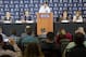 New York Yankees general manager Brian Cashman, left, and manager Aaron Boone watch as new player Giancarlo Stanton, center, talks as Hal Steinbrenner, middle right, and Jean Afterman, left watch during the Major League Baseball winter meetings in Orlando, Fla., Monday, Dec. 11, 2017. (AP Photo/Willie J. Allen Jr.)