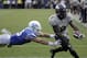 Central Florida running back Adrian Killins Jr. (9) runs for a 2-yard touchdown against Memphis during the overtime period in the American Athletic Conference championship NCAA college football game, Saturday, Dec. 2, 2017, in Orlando, Fla. Central Florida won in overtime 62-55. (AP Photo/John Raoux)