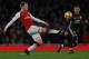 Arsenal's Welsh midfielder Aaron Ramsey (L) vies with Manchester United's English midfielder Jesse Lingard during the English Premier League football match between Arsenal and Manchester United at the Emirates Stadium in London on December 2, 2017. / AFP PHOTO / Adrian DENNIS / RESTRICTED TO EDITORIAL USE. No use with unauthorized audio, video, data, fixture lists, club/league logos or 'live' services. Online in-match use limited to 75 images, no video emulation. No use in betting, games or single club/league/player publications. / (Photo credit should read ADRIAN DENNIS/AFP/Getty Images)