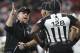 New Orleans Saints head coach Sean Payton speaks to umpire Ramon George during the second half of an NFL football game against the Atlanta Falcons, Thursday, Dec. 7, 2017, in Atlanta. (AP Photo/John Bazemore)