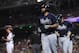 Atlanta Braves' Matt Kemp, center, runs back to their dugout with his teammate Freddie Freeman, right, after hitting a grand slam during the seventh inning of a baseball game against the Washington Nationals in Washington, Wednesday, Sept. 13, 2017. Washington Nationals catcher Matt Wieters stands on the left. (AP Photo/Manuel Balce Ceneta)