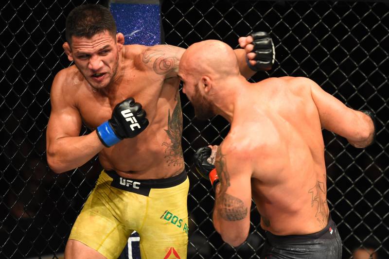WINNIPEG, CANADA - DECEMBER 16: (L-R) Rafael Dos Anjos of Brazil punches Robbie Lawler in their welterweight bout during the UFC Fight Night event at Bell MTS Place on December 16, 2017 in Winnipeg, Manitoba, Canada. (Photo by Josh Hedges/Zuffa LLC/Zuffa LLC via Getty Images)