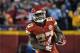 Kansas City Chiefs running back Kareem Hunt (27) carries the ball during the first half of an NFL football game against the Los Angeles Chargers in Kansas City, Mo., Saturday, Dec. 16, 2017. (AP Photo/Ed Zurga)