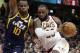 Cleveland Cavaliers' LeBron James, right, drives against Utah Jazz's Alec Burks (10) in the second half of an NBA basketball game, Saturday, Dec. 16, 2017, in Cleveland.(AP Photo/Tony Dejak)