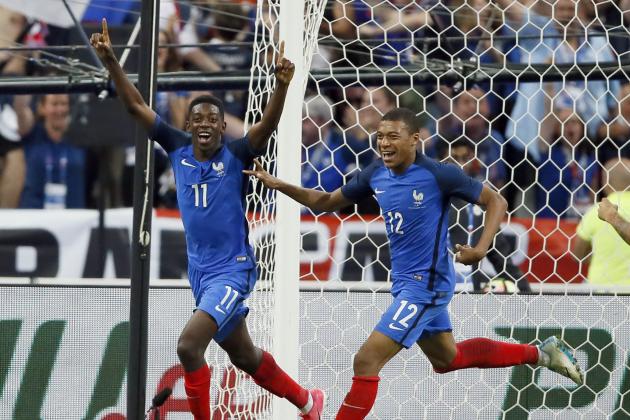 France's Ousmane Dembele, left, celebrates after scoring his side's 3rd goal while France's Kylian Mbappe looks on during their friendly soccer match between France and England at the Stade de France in Saint Denis, north of Paris, France, Tuesday, June 13, 2017. (AP Photo/Francois Mori)
