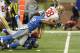 San Francisco 49ers running back Jarryd Hayne is stopped by Detroit Lions defensive end Darryl Tapp (52) during the first half of an NFL football game, Sunday, Dec. 27, 2015, in Detroit. (AP Photo/Jose Juarez)