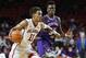 Oklahoma guard Trae Young (11) drives past Northwestern State forward Brandon Hutton, right, in the second half of an NCAA college basketball game in Norman, Okla., Tuesday, Dec. 19, 2017. Oklahoma won 105-68. (AP Photo/Sue Ogrocki)