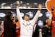 CHARLOTTE, NC - DECEMBER 02: Head coach Dabo Swinney of the Clemson Tigers celebrates with the trophy after defeating the Miami Hurricanes 38-3 in the ACC Football Championship at Bank of America Stadium on December 2, 2017 in Charlotte, North Carolina. (Photo by Streeter Lecka/Getty Images)