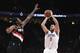 Los Angeles Clippers forward Danilo Gallinari shoots a basket over Portland Trail Blazers forward Al-Farouq Aminu during the first quarter of an NBA basketball game in Portland, Ore., Thursday, Oct. 26, 2017. (AP Photo/Steve Dykes)