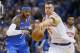 Oklahoma City Thunder forward Carmelo Anthony (7) and New York Knicks forward Kristaps Porzingis (6) reach for the ball in the second quarter of an NBA basketball game in Oklahoma City, Thursday, Oct. 19, 2017. (AP Photo/Sue Ogrocki)