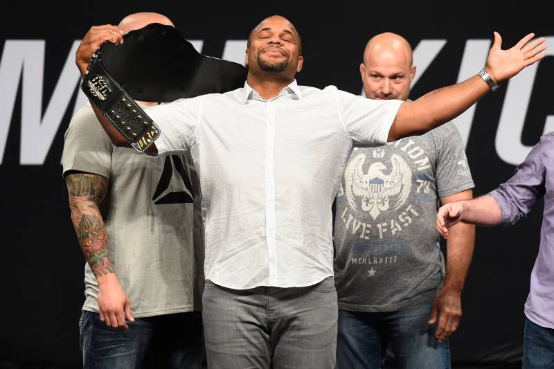 DALLAS, TX - MAY 12: UFC light heavyweight champion Daniel Cormier raises his belt during the UFC Summer Kickoff Press Conference at the American Airlines Center on May 12, 2017 in Dallas, Texas. (Photo by Josh Hedges/Zuffa LLC/Zuffa LLC via Getty Images)