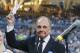 San Diego Padres broadcaster Dick Enberg waves to crowd at a retirement ceremony prior to the Padres final home baseball game of the season, against the Los Angeles Dodgers on Thursday, Sept. 29, 2016, in San Diego. (AP Photo/Lenny Ignelzi)