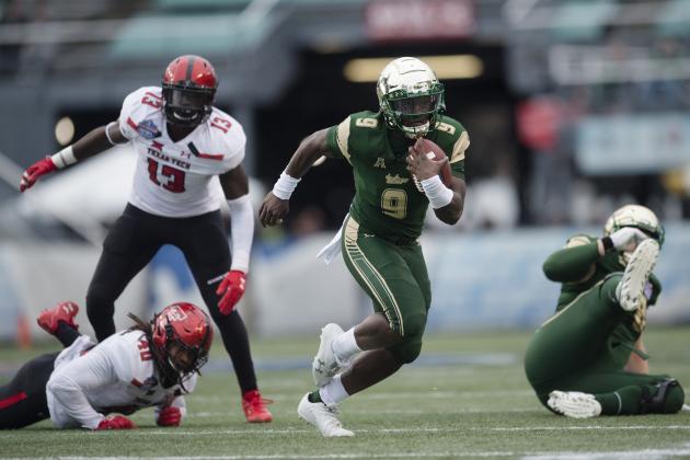 South Florida quarterback Quinton Flowers (9) runs downfield during the first half the Birmingham Bowl NCAA college football game, Saturday, Dec. 23, 2017 in Birmingham, Ala. (AP Photo/Albert Cesare)