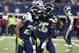 Seattle Seahawks' Justin Coleman (28) and Shaquill Griffin (26) celebrate a touchdown scored by Coleman on a Dallas Cowboys' Dak Prescott interception in the second half of an NFL football game, Sunday, Dec. 24, 2017, in Arlington, Texas. (AP Photo/Michael Ainsworth)