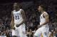 PHILADELPHIA, PA - DECEMBER 10: Dhamir Cosby-Roundtree #21 of the Villanova Wildcats reacts along with Phil Booth #5 after dunking the ball and getting fouled in the first half against the La Salle Explorers at the Wells Fargo Center on December 10, 2017 in Philadelphia, Pennsylvania. (Photo by Mitchell Leff/Getty Images)
