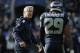 Seattle Seahawks head coach Pete Carroll talks with Seattle Seahawks free safety Earl Thomas before an NFL football game against the Tampa Bay Buccaneers, Sunday, Nov. 3, 2013, in Seattle. (AP Photo/Stephen Brashear)