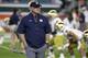 FILE - In this Nov. 11, 2017, file photo, Notre Dame head coach Brian Kelly walks on the field before an NCAA college football game against Miami in Miami Gardens, Fla. The game between No. 9 Notre Dame and No. 20 Stanford may not carry the pomp and circumstances of some previous meetings, but it does give Irish coach Brian Kelly his latest chance to complete an elusive mission: beat a ranked team on the road. (AP Photo/Lynne Sladky, File)
