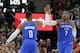 Oklahoma City Thunder's Russell Westbrook (0) receives a high-five from teammate Carmelo Anthony (7) after scoring three-point basket against the Utah Jazz in the second half during an NBA basketball game Saturday, Dec. 23, 2017, in Salt Lake City. (AP Photo/Rick Bowmer)