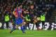 Arsenal's Chilean striker Alexis Sanchez (R) controls the ball on his way to score the their third goal during the English Premier League football match between Crystal Palace and Arsenal at Selhurst Park in south London on December 28, 2017. / AFP PHOTO / Ben STANSALL / RESTRICTED TO EDITORIAL USE. No use with unauthorized audio, video, data, fixture lists, club/league logos or 'live' services. Online in-match use limited to 75 images, no video emulation. No use in betting, games or single club/league/player publications. / (Photo credit should read BEN STANSALL/AFP/Getty Images)