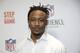 New York Giants Brandon Marshall poses for a picture at the opening of