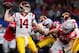ARLINGTON, TX - DECEMBER 29: Sam Darnold #14 of the USC Trojans looks for an open receiver against Nick Bosa #97 of the Ohio State Buckeyes during the Goodyear Cotton Bowl Classic at AT&T Stadium on December 29, 2017 in Arlington, Texas. (Photo by Tom Pennington/Getty Images)