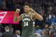 Milwaukee Bucks forward Giannis Antetokounmpo (34) celebrates after the NBA basketball game against the Oklahoma City Thunder in Oklahoma City, Friday, Dec.29, 2017. The Bucks defeated the Thunder 97-95. (AP Photo/J Pat Carter)