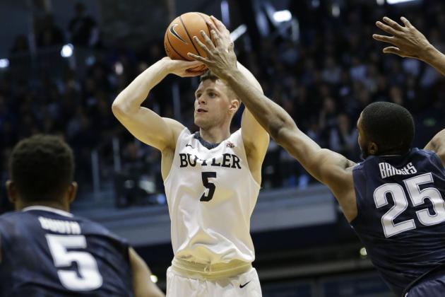 Butler guard Paul Jorgensen (5) shoots in front of Villanova defenders Phil Booth (5) and Mikal Bridges (25) in the first half of an NCAA college basketball game in Indianapolis, Saturday, Dec. 30, 2017. (AP Photo/AJ Mast)
