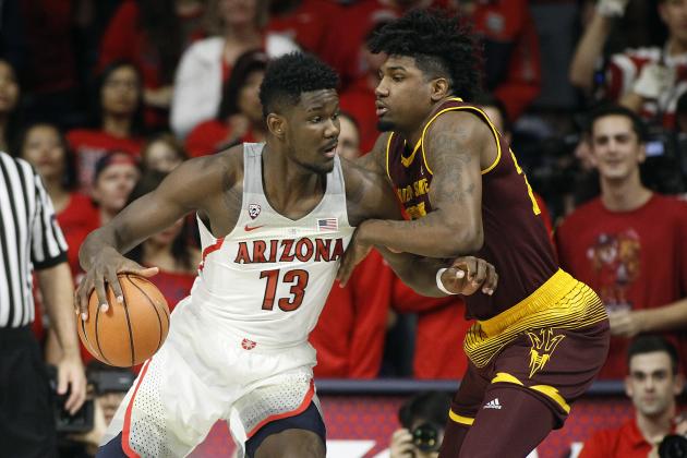 Arizona forward Deandre Ayton (13) works toward the basket as Arizona State's Romello White defends during the first half of an NCAA college basketball game, Saturday, Dec. 30, 2017, in Tucson, Ariz. (AP Photo/Ralph Freso)