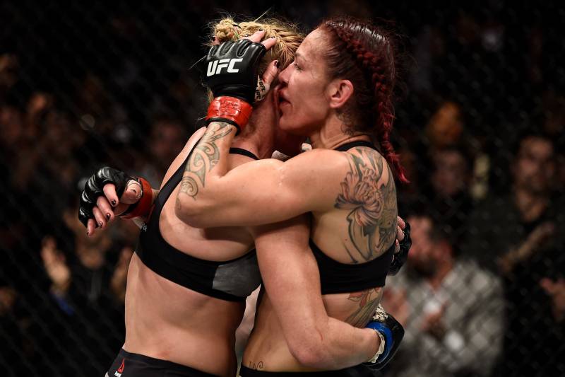 LAS VEGAS, NV - DECEMBER 30: (R-L) Cris Cyborg of Brazil and Holly Holm hug after the conclusion after their women's featherweight bout during the UFC 219 event inside T-Mobile Arena on December 30, 2017 in Las Vegas, Nevada. (Photo by Jeff Bottari/Zuffa LLC/Zuffa LLC via Getty Images)