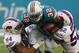 Buffalo Bills middle linebacker Preston Brown (52) and nose tackle Rickey Hatley (94), attempt to stop Miami Dolphins running back Kenyan Drake (32), during the first half of an NFL football game, Sunday, Dec. 31, 2017, in Miami Gardens, Fla. (AP Photo/Wilfredo Lee)