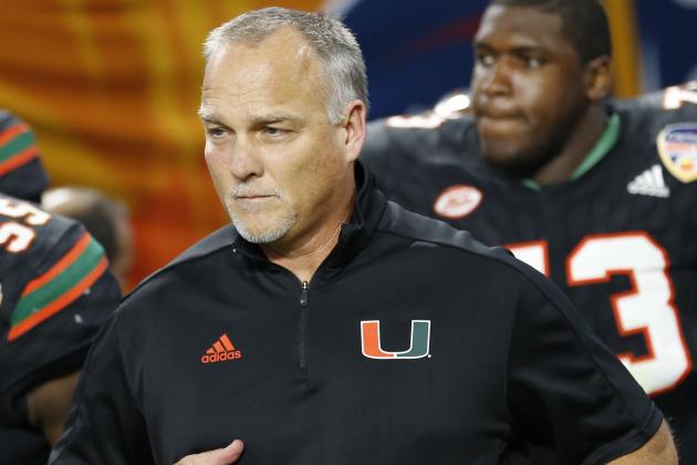 Miami head coach Mark Richt enter the field during the second half of the Orange Bowl NCAA college football game against Wisconsin, Saturday, Dec. 30, 2017, in Miami Gardens, Fla. (AP Photo/Joe Skipper)