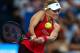 PERTH, AUSTRALIA - JANUARY 01: Angelique Kerber of Germany plays a backhand to Elise Mertens of Belgium in the womens singles match on day 3 during the 2018 Hopman Cup at Perth Arena on January 1, 2018 in Perth, Australia. (Photo by Paul Kane/Getty Images)